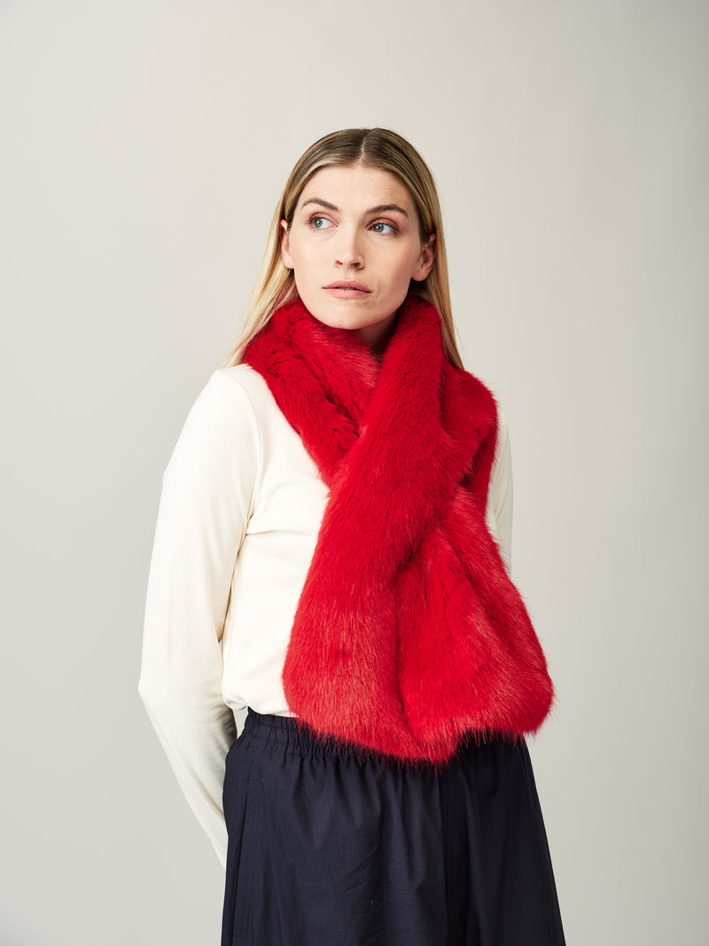 Model wearing the Cola red faux fur Luxe scarf by Helen Moore