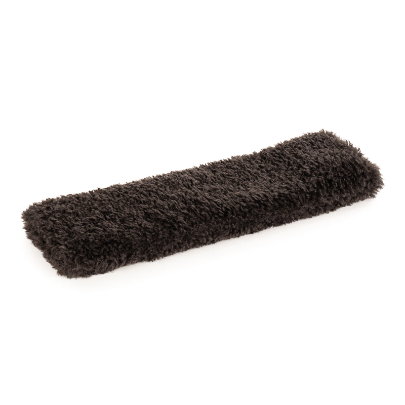 Charcoal faux sheepskin long wheat pillow by Helen Moore