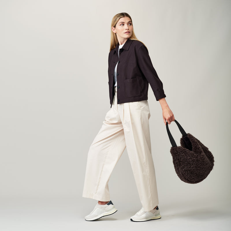 Model holding the Charcoal faux sheepskin Slouch Bag by Helen Moore