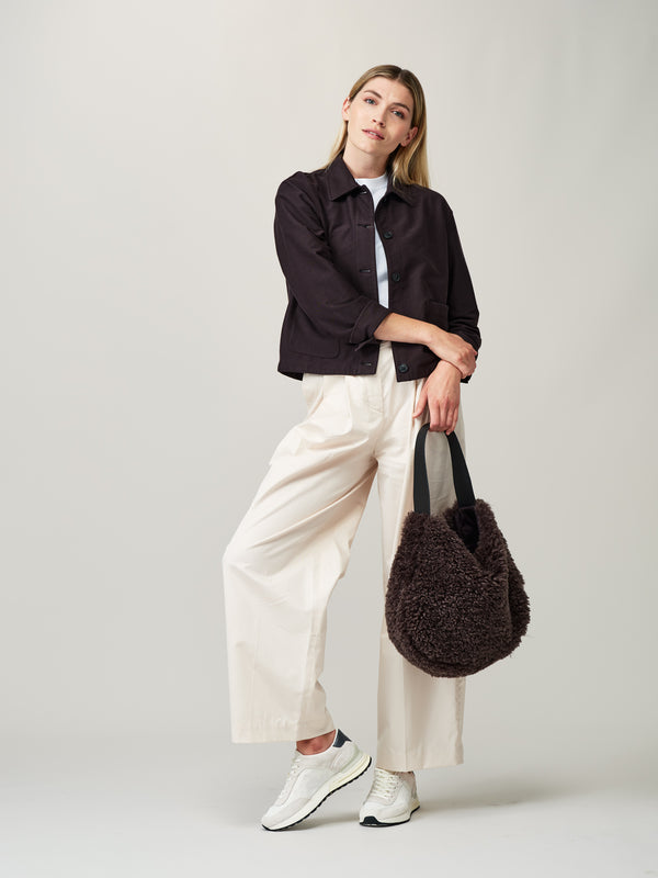 Model holding the Charcoal faux sheepskin Slouch Bag by Helen Moore