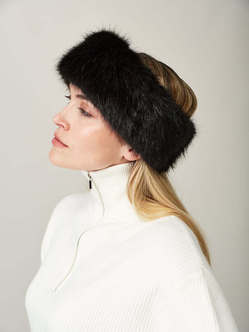 Women wearing a jet black faux fur headband looking up