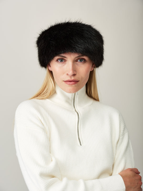 Women wearing a jet black faux fur headband