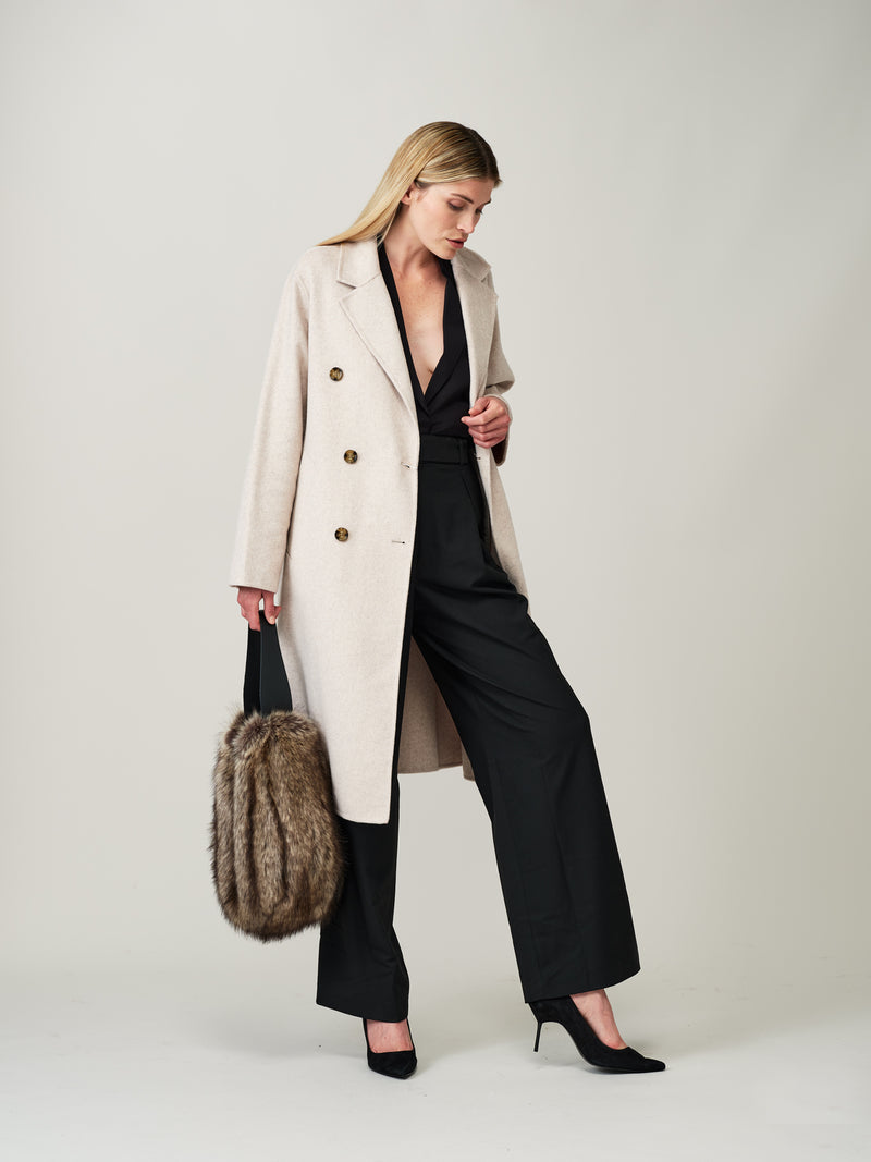 Model holding the Lady Grey faux fur Slouch Bag by Helen Moore