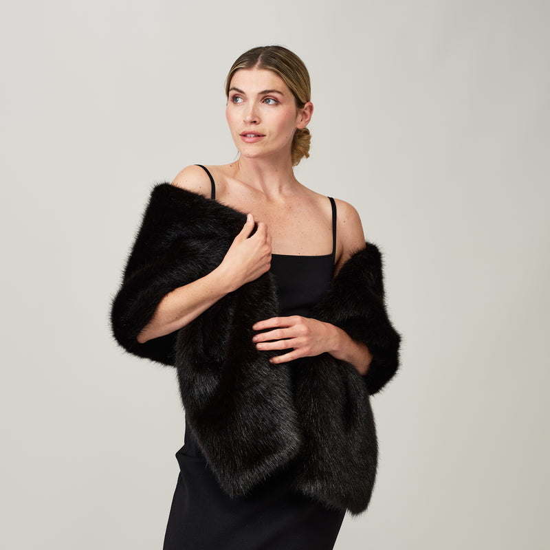 Model wearing a Jet black faux fur stole by Helen Moore