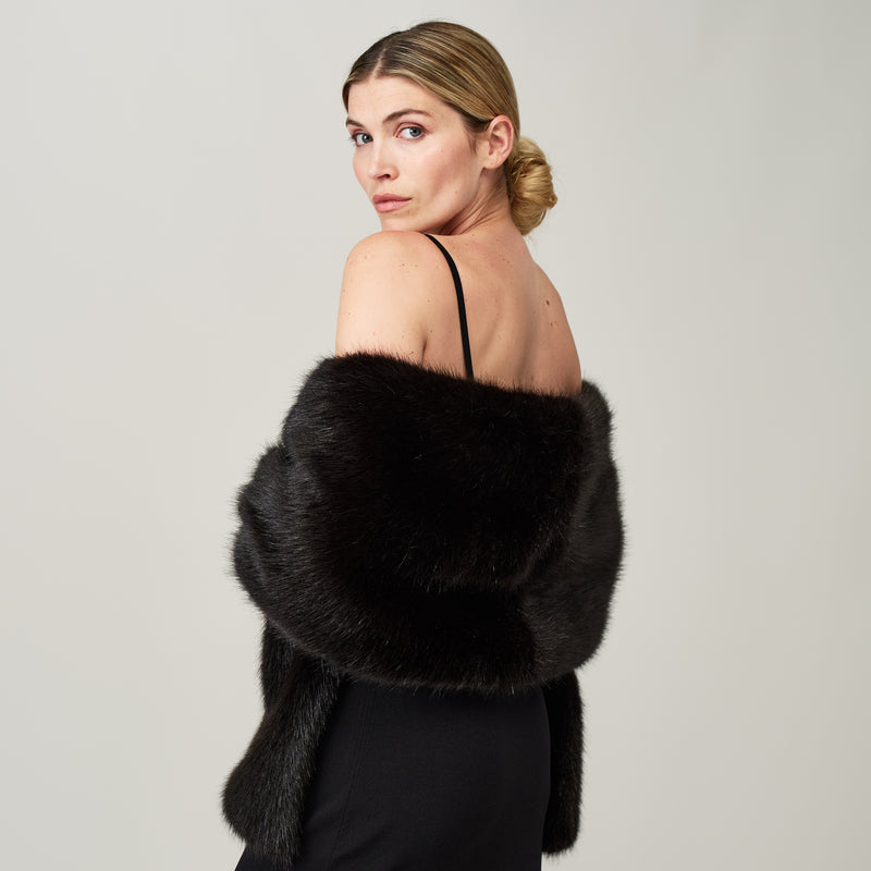 Model wearing a Jet black faux fur stole by Helen Moore