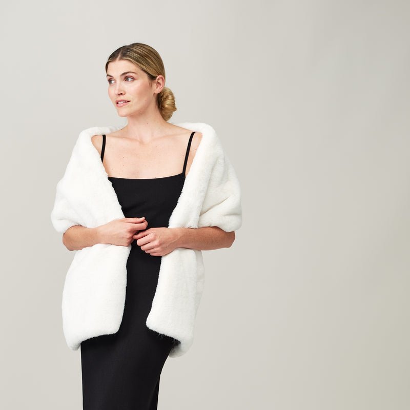 Model wearing an Ivory Cloud faux fur stole by Helen Moore