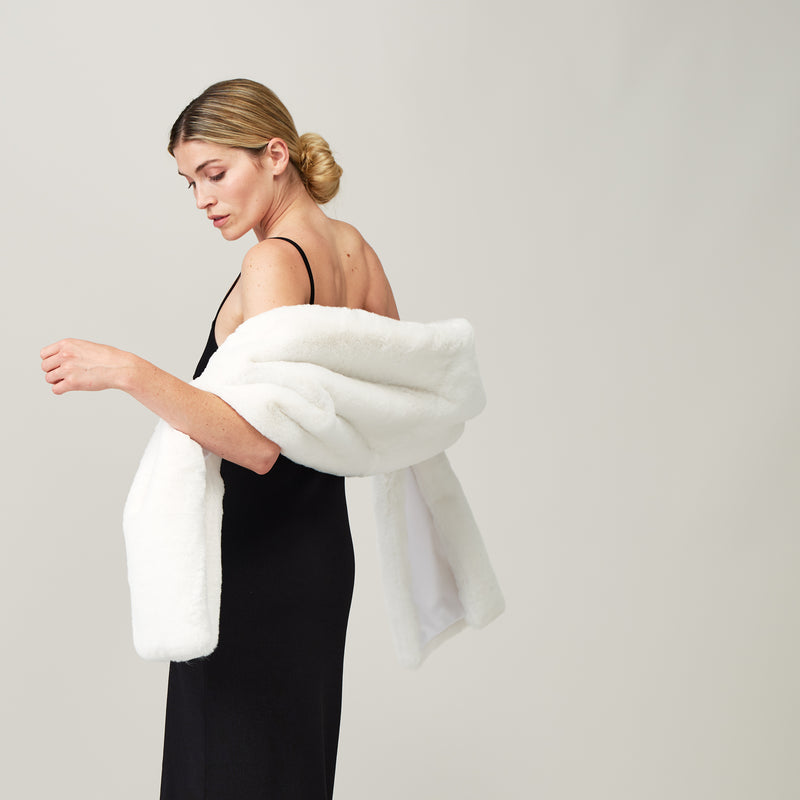 Model wearing an Ivory Cloud faux fur stole by Helen Moore