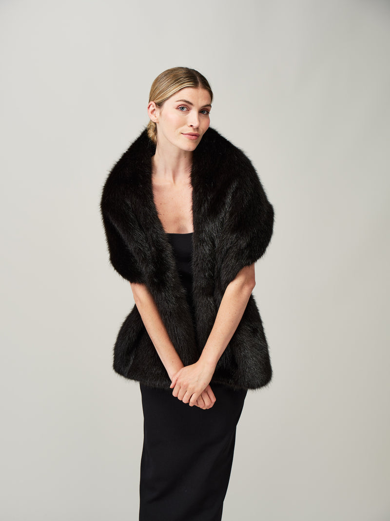 Model wearing a Jet black faux fur stole by Helen Moore